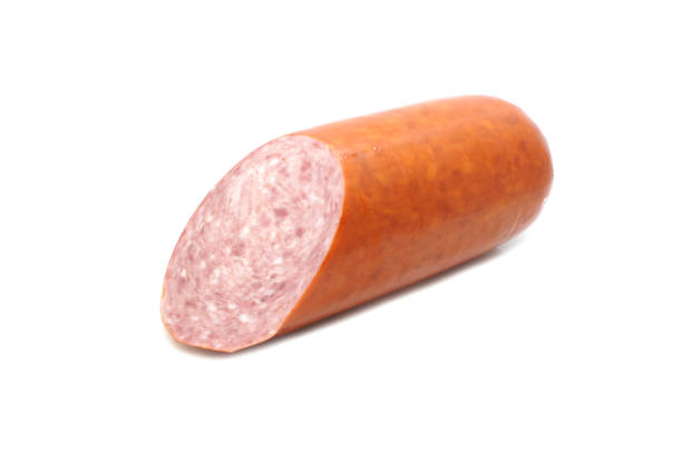 istock Semi-smoked sliced sausage with a shadow isolated on white background. Close-up. 1309896581