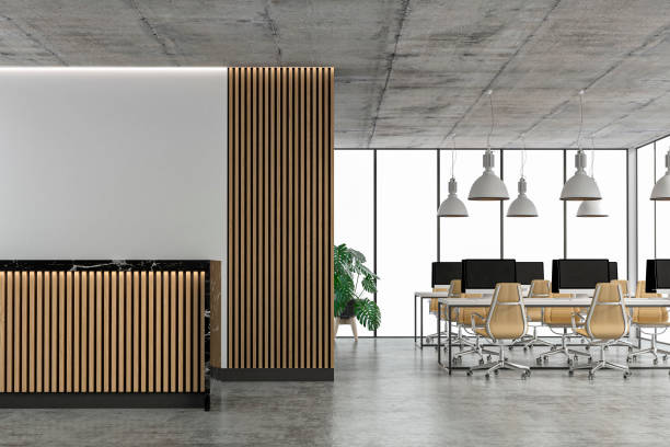 istock Empty office interior with copy space and wordesks and reception desk on concrete floor 1309897530
