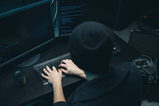 istock Close up on the hand of a young hacker who is typing on a computer keyboard with malware. An anonymous online scammer is looking to steal consumer data using computers 1309899265