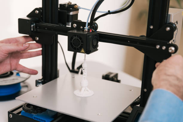 istock Detail men's hands working with a 3d printer 1309901458