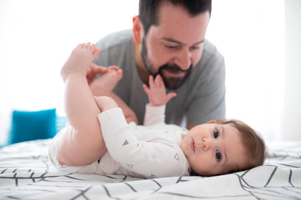 istock Happy father playing with his baby daughter 1309902431