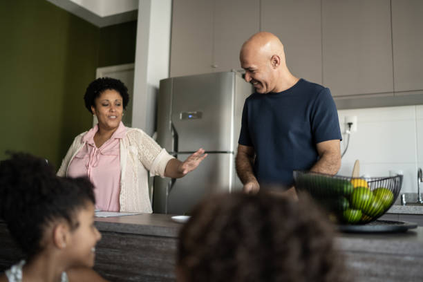 istock Couple cooking in the kitchen at home 1309902486