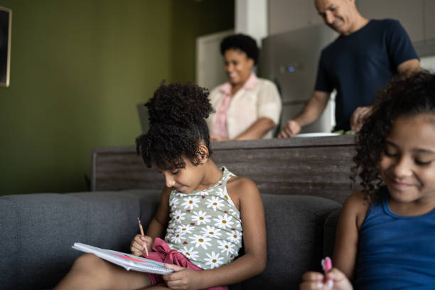 istock Sisters studying together at home 1309902496