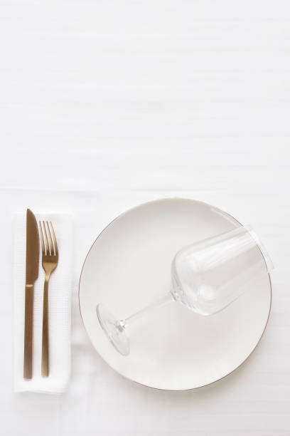 istock Elegant table setting in white gold tone 1309902663