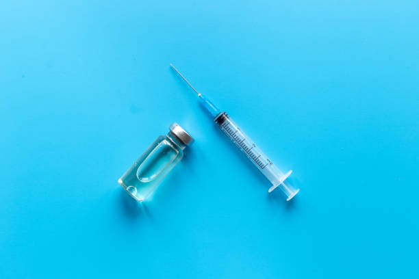 istock Vaccine in vial bottle with syringe. Vaccination concept 1309904479