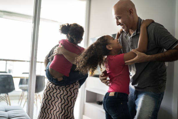 istock Family dancing together at home 1309905444