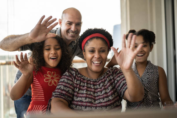 istock Happy family doing a virtual happy hour at home 1309905517