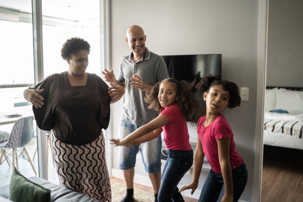 istock Family dancing together at home 1309905598