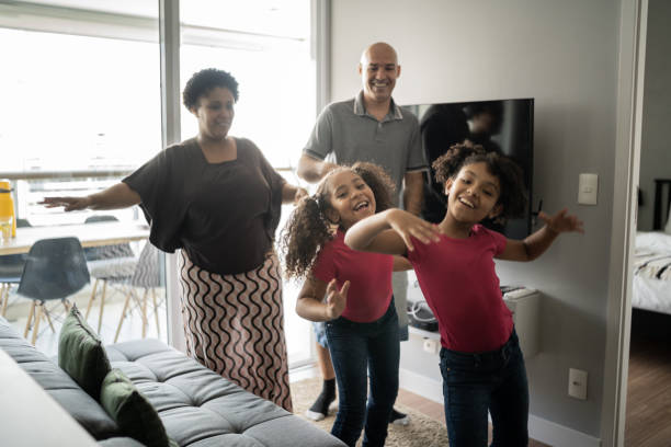 istock Family dancing together at home 1309906216