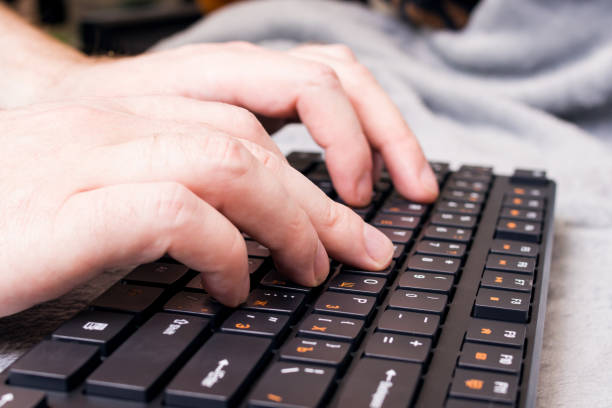 istock Keys on black keyboard and hand closeup 1309907669