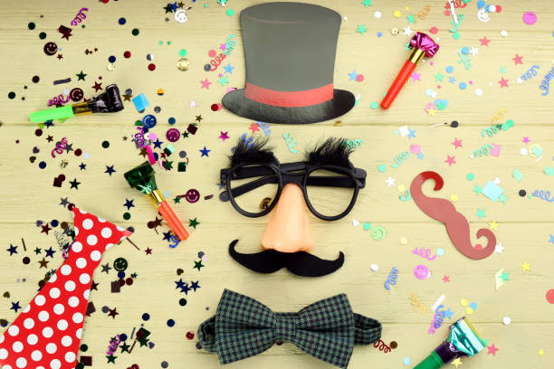 istock Flat lay composition with clown's items on light wooden table 1309907740