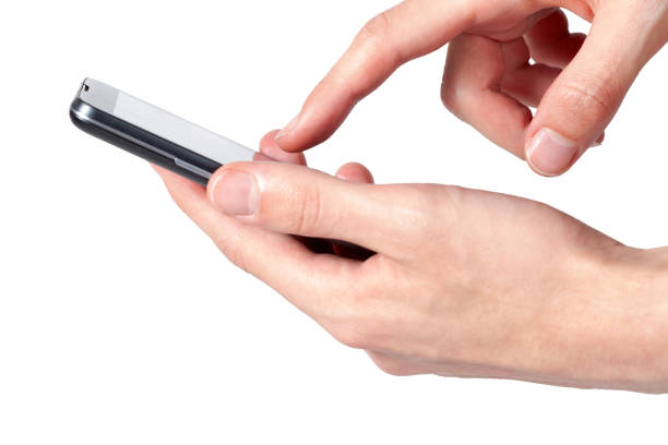 istock Finger tapping smartphone screen, phone held in hand, modern smart phone in hands, interacting with a mobile app concept. Finger overing over display. Simple tap gesture isolated on white, cut out 1309909112