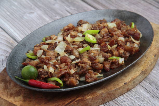 istock reshly cooked Filipino food called Pork Sisig 1309909393