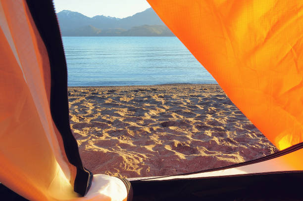 istock Tent by the mountain lake. 1309910766