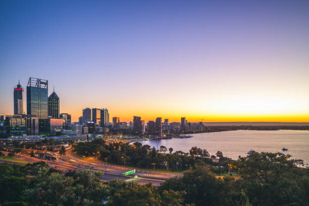 skyline of perth skyline of perth cbd at dawn in western australia, australia swan at dawn stock pictures, royalty-free photos & images