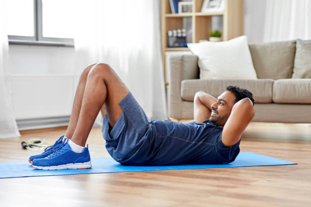 istock indian man making abdominal exercises at home 1309914284