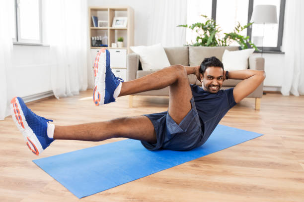 istock indian man making abdominal exercises at home 1309914419