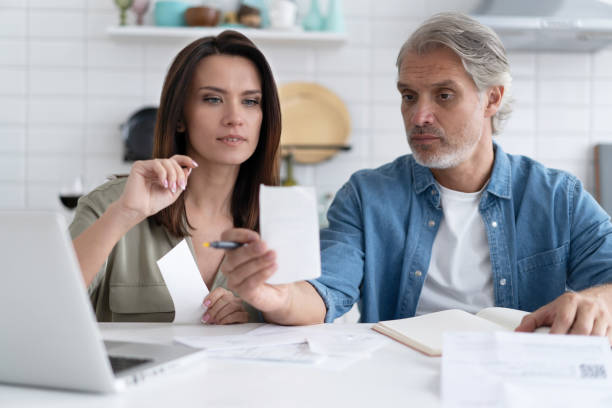 istock Stressed family couple received debt mortgage notification, checking financial documents 1309915604