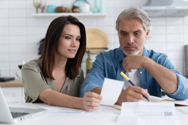 istock Stressed family couple received debt mortgage notification, checking financial documents 1309915605