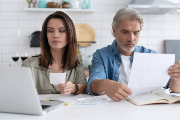 istock Stressed family couple received debt mortgage notification, checking financial documents 1309915614