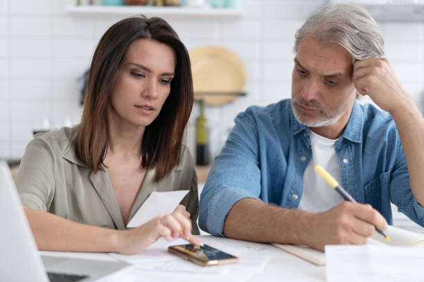istock Stressed family couple received debt mortgage notification, checking financial documents 1309915616