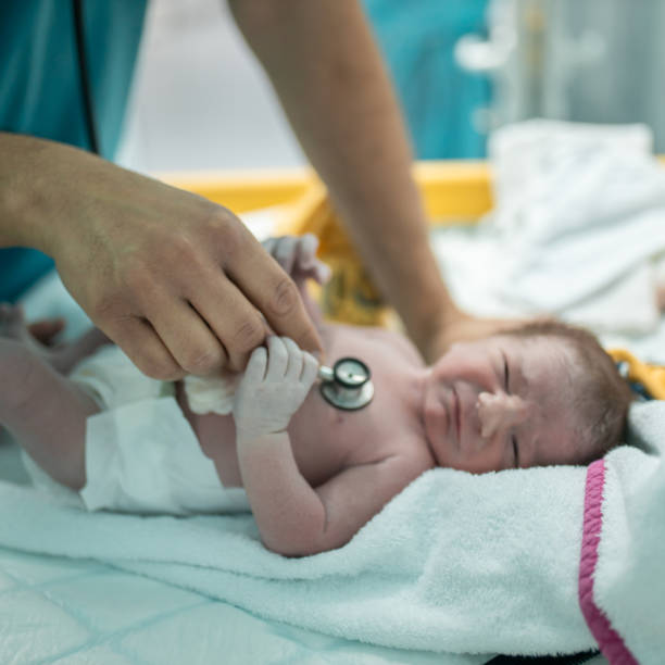istock Doctor examining newborn baby with stethoscope 1309916363