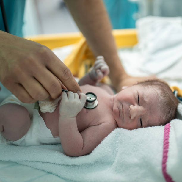 istock Doctor examining newborn baby with stethoscope 1309917138
