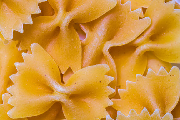 istock Macro selective focus of raw pasta. Background of uncooked pasta 1309921387