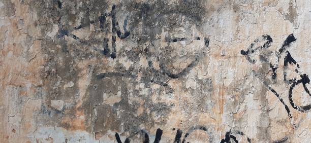 istock Old wall, wall with traces of multi-colored paint, painted old background 1309922816