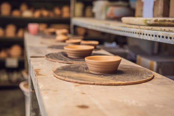 istock Cups on the shelves in the pottery workshop 1309924131