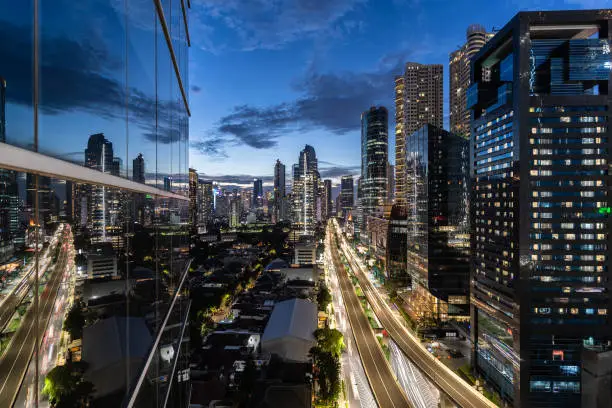 Dramatic twilight over the Kuningan business district in Jakarta, Indonesia capital city and a major financial center in Southeast Asia.