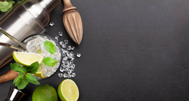 istock Mojito cocktail making. Ingredients and drink utensils 1309924820