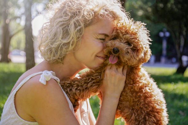 istock Happy woman with her dog 1309925529