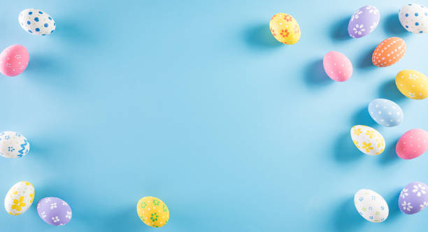 istock Happy easter! Colourful of Easter eggs on pastel blue background. Greetings and presents for Easter Day celebrate time. Flat lay ,top view. 1309926180