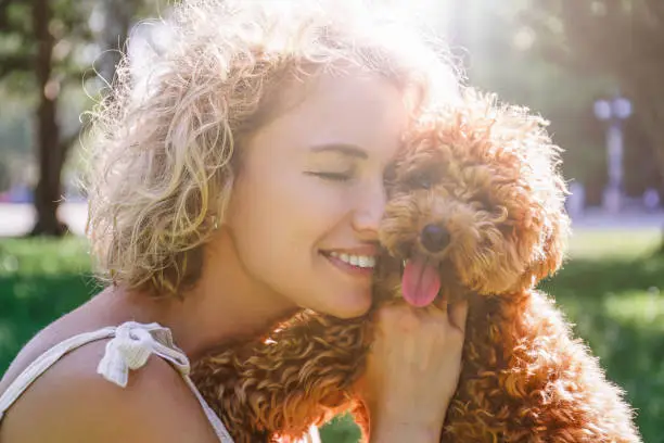 Photo of Happy woman with her dog