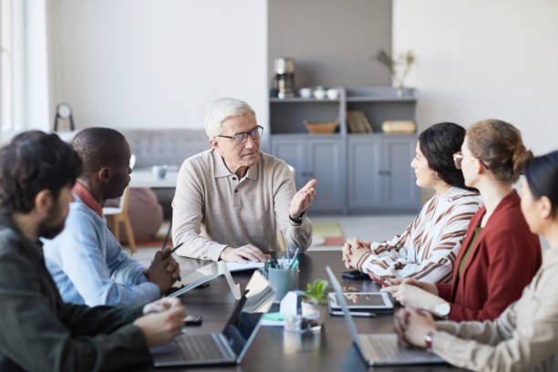 istock Senior Team Leader in Meeting 1309928214