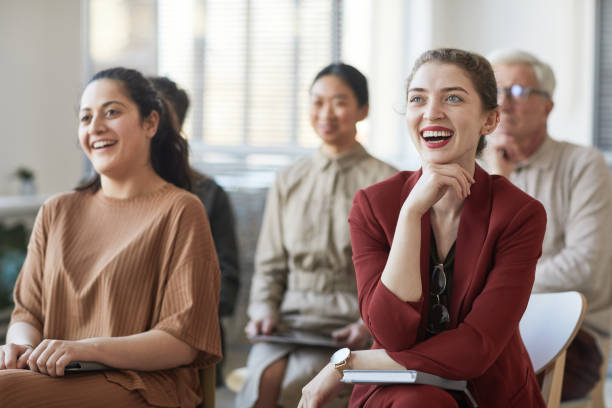 istock Smiling Audience Listening to Seminar 1309928286