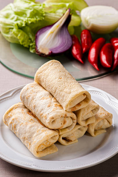 istock Homemade pancakes stuffed on a white plate. Blini 1309928487
