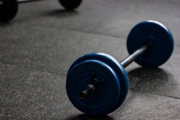 istock weights on the floor of a gym 1309928542