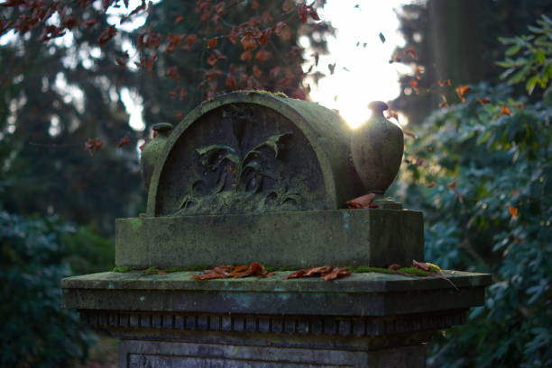 istock Stone urns at the grave 1309930117
