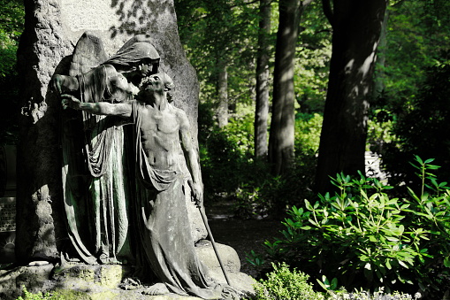 Old statue of angel in cemetery