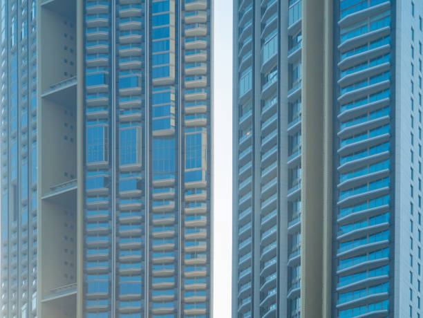 istock Pattern of office buildings windows. Glass architecture facade design with reflection in urban city, Downtown Dubai. Urban city in financial district with blue sky. 1309933564