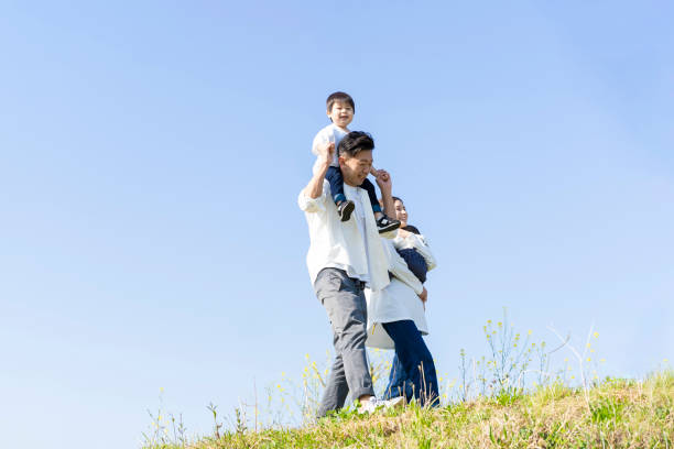 istock parents and children walking with a smile 1309934431