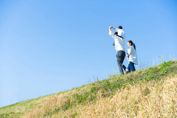 istock parents and children walking with a smile 1309934503
