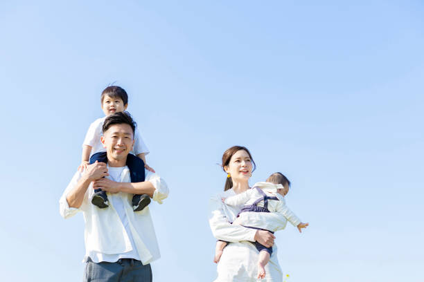 istock parents and children walking with a smile 1309934526