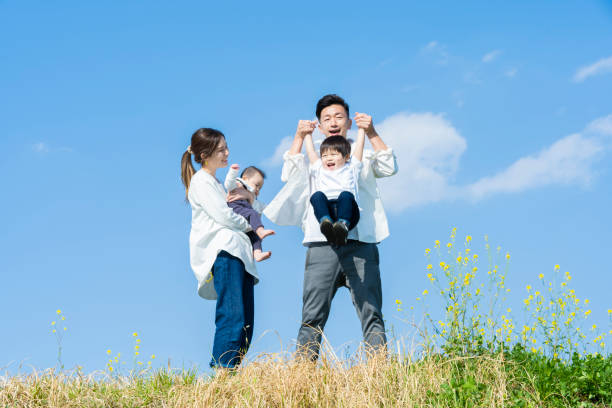 istock parents and children walking with a smile 1309934561