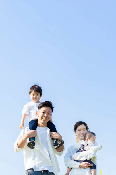 istock parents and children walking with a smile 1309934703