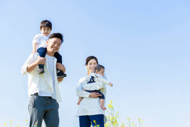 istock parents and children walking with a smile 1309934770