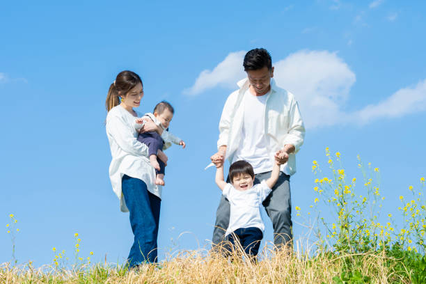 istock parents and children walking with a smile 1309934787