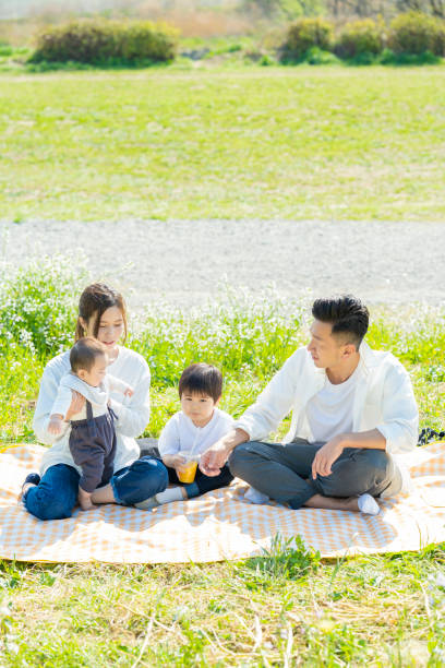 istock Parents and children enjoying a picnic 1309936060